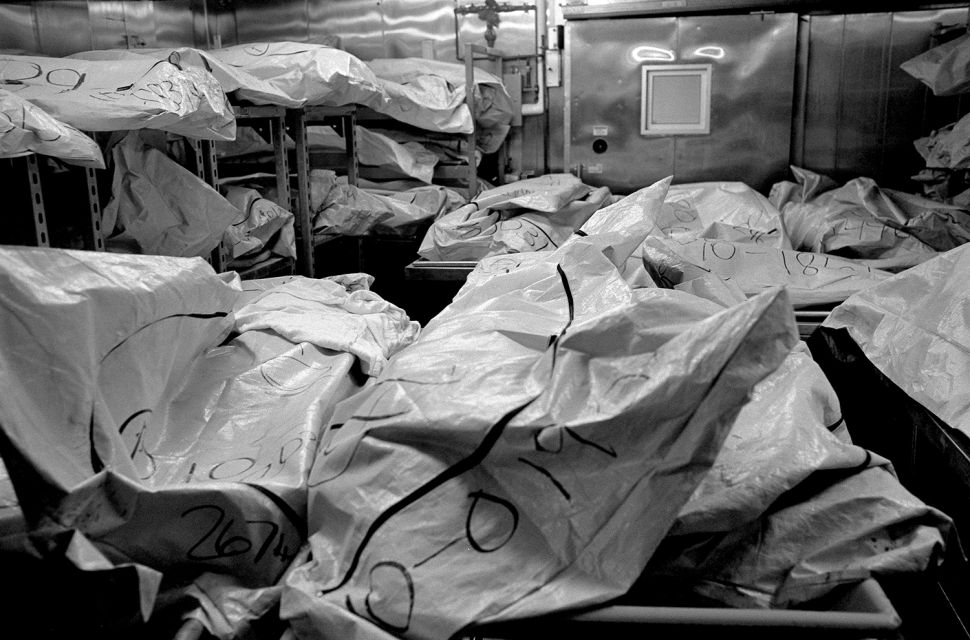 Body bags fill a cooler at the Wayne County morgue; the deceased unclaimed, often due to relativeís inability to pay for a loved oneís burial. Summary: A Detroit Requiem      DetroitÖthe word alone incites many emotions within Americaís conscience.† Detroit was the epicenter for financial equality in the U.S., the home front for the ideal of well-paying jobs for the masses and a political force behind a strong middle class.† Henry Ford made Detroit a boomtown.† Five decades after he started, the boom began to bust.† Many reasons are at the heart of Detroitís decline: postwar industrial policies, urban planning, the 1967 race riots, UAW and auto industry management, Detroitís political cronyism, Clinton era trade deals, and quite possibly the mobility of the automobile itself.† It was the 1950ís when Detroit began the long decay that has brought the city to its present state, a time when Detroit, and America, was at its peak.      Today, Detroit is Americaís poorest large city.† To avoid being the nationís perpetual murder capital, the police began cooking stats.† In 2008, they claimed 306 homicides ñ until The Detroit News discovered that there were actually 375.† In more than 70 percent of murders in Detroit, the killer got away with it.† Detroitís East Side is now the poorest, most violent quarter of Americaís poorest, most violent big city.† The illiteracy, child poverty, and unemployment rates hover around 50 percent.† The shooting death of seven-year-old Aiyana Stanley-Jones by police on Detroitís East Side brought national attention to this quarter over the summer of 2010.† But as the spotlight faded, the killings continued.      With 103 kids and teens murdered in Detroit between January of 2009 and July of 2010, I was sent to cover the failure of political and civil leaders in Detroit, the failure of industry in Detroit, the failure of the federal government in Detroit, the failure of America in Detroit.