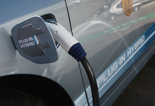 SAN FRANCISCO - AUGUST 25: A power cable from a vehicle charging station is seen plugged into the side of a Toyota Prius plug-in hybrid August 25, 2010 in San Francisco, California. With sales of electric and plug-in hybrid cars expected to increase in the coming years, the Bay Area Air Quality Management District has set aside $5 million to increase the number of electric car charging stations to 5,000 around the Bay Area. There are currently 120 stations in the area.