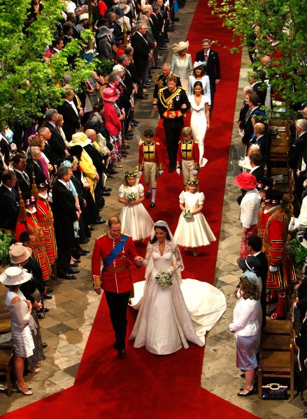 LONDON, ENGLAND - APRIL 29: Prince William, Duke of Cambridge and his new bride Catherine, Duchess of Cambridge walk down the aisle at the close of their wedding ceremony at Westminster Abbey on April 29, 2011 in London, England. The marriage of Prince William, the second in line to the British throne, to Catherine Middleton is being held in London today. The Archbishop of Canterbury conducted the service which was attended by 1900 guests, including foreign Royal family members and heads of state. Thousands of well-wishers from around the world have also flocked to London to witness the spectacle and pageantry of the Royal Wedding and street parties are being held throughout the UK.