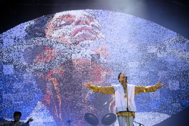 US singer and musician Prince (born Prince Rogers Nelson) performs on stage at the Stade de France in Saint-Denis, outside Paris, on June 30, 2011. 