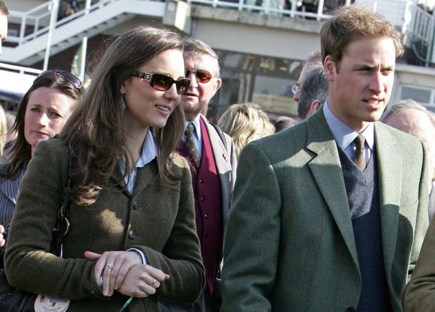 Britain's Prince William (R) stands beside girlfriend Kate Middleton (L) in the paddock enclosure on the first day of the Cheltenham Race Festival at Cheltenham Race course, in Gloucestershire 13 March 2007.