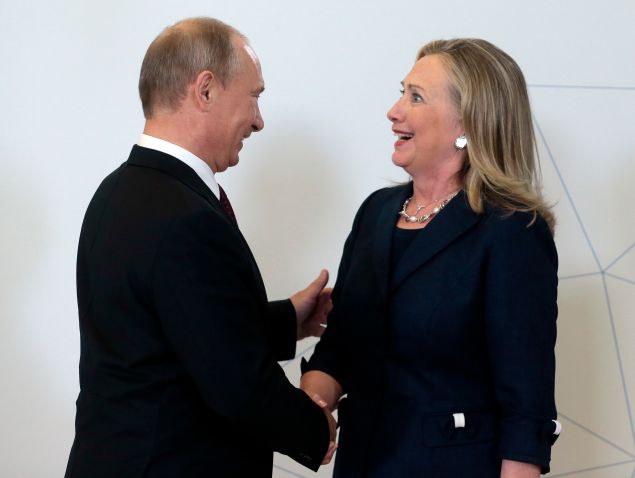 Vladimir Putin welcomes then-Secretary of State Hillary Clinton during the Asia-Pacific Economic Cooperation Summit in Russia in 2012.