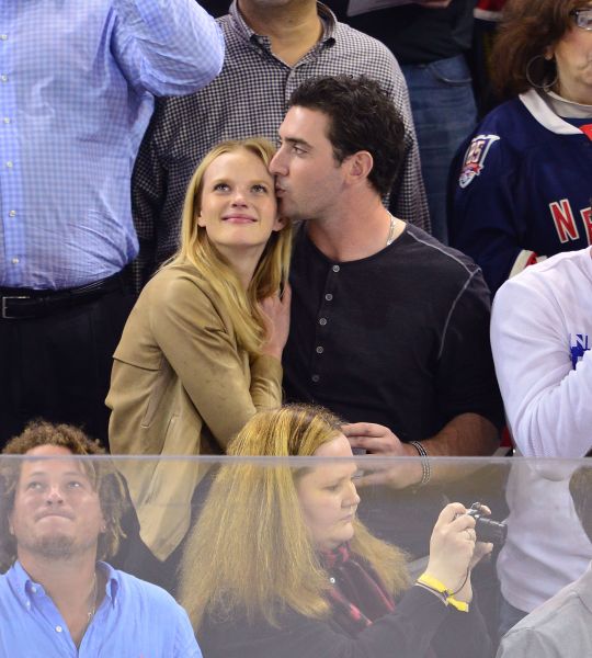 Harvey snuggles with then-girlfriend Anne V. at a Rangers' game in 2013 in New York City.