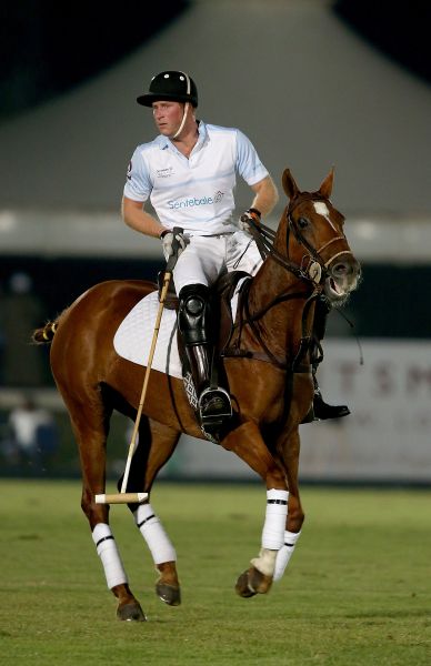 Prince Harry plays during the Sentebale Polo Cup presented by Royal Salute World Polo at Ghantoot Polo Club on November 20, 2014 in Abu Dhabi, United Arab Emirates.