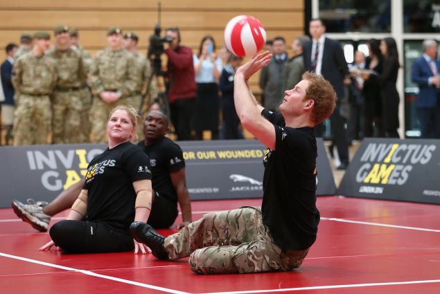 LONDON, ENGLAND - MARCH 06: Prince Harry plays sitting Volley Ball as he takes part in a match at the media launch for the Invictus Games 2014 at the Copper Box Arena in the Olympic Park on March 6, 2014 in London, England. The Invictus Games for wounded, injured and sick serivce personnel will use the power of sport to inspire recovery, support rehabilitation and generate a wider understanding of those who serve the country. Prince Harry has brought the Games to the UK following a trip to see the Warrior Games in Colorado in 2013. 300 competitors from around the world will take part from the 10th-14th September.