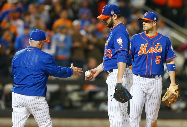 Matt Harvey of the New York Mets hands the ball to manager Terry Collins, as he leaves in the ninth inning against the Kansas City Royals Field in the ninth inning of Game Five of the 2015 World Series.