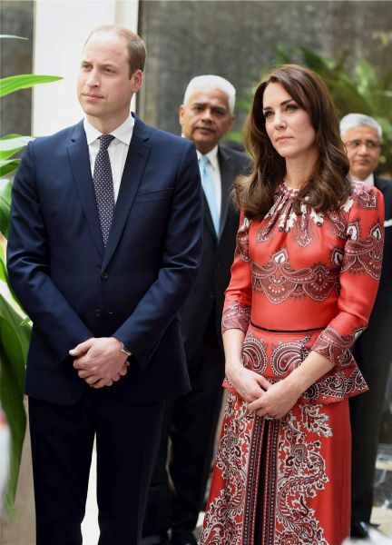 Britain's Prince William, Duke of Cambridge(C)and Catherine, Duchess of Cambridge(R) look on during a ceremony at the martyrs memorial at Taj Mahal Palace Hotel in Mumbai on April 10, 2016. Britain's Prince William and wife Kate landed in Mumbai for a tour of India that will see them play with slum children and mingle with Bollywood celebrities. / AFP / POOL / STR (Photo credit should read STR/AFP/Getty Images)