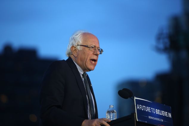 Democratic Presidential candidate Bernie Sanders speaks at a campaign rally on the eve of the New York primary, April 18, 2016 in the Queens borough of New York City. While Sanders is still behind in the delegate count with Hillary Clinton, he has energized many young and liberal voters around the country. New York holds its primary this Tuesday.
