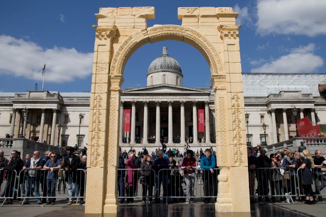 A replica of Palmyra's Arch of Triumph with the National Portrait Gallery framed behind is unveiled in Trafalgar Square, central London, on 19 April 2016. The original arch was destroyed by the Islamic State (IS) and the replica has been crafted using the latest 3D printing and carving technologies by the Institute for Digital Archaeology.