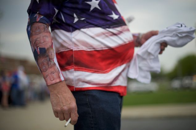 Chris Wolfersberger, 62, smokes a cigarette, with Donald Trump themed socks worn on his forearms, before the Republican presidential hopeful holds a campaign rally at the Pennsylvania Farm Show Complex & Expo Center on April 21, 2016 in Harrisburg, Pennsylvania. The Pennsylvania Primary takes place on April 26.