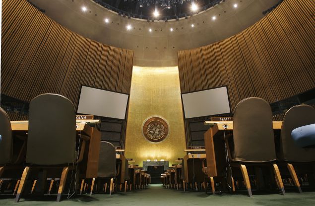 The United Nations logo on the back wall of the General Assembly Hall of the United Nations is seen from the floor May 12, 2006 at the United Nations headquarters in New York.
