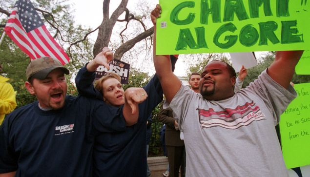 381733 07: Victor Reed, right, a pro-Gore supporter, is yelled at by pro-Bush supporters outside the Texas governor's mansion November 11, 2000, in Austin, Texas. Bush, spending the weekend at his ranch, complained about the state of the presidential election being in "limbo." (Photo by Joe Raedle/Newsmakers)
