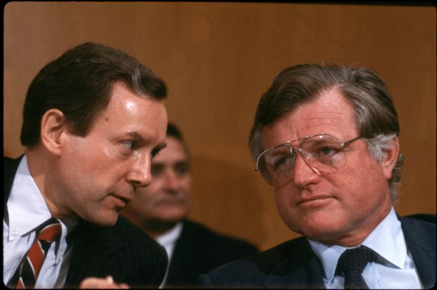 Bipartisan Buds: Sen. Orrin Hatch and Sen. Kennedy share a word in 1982. 