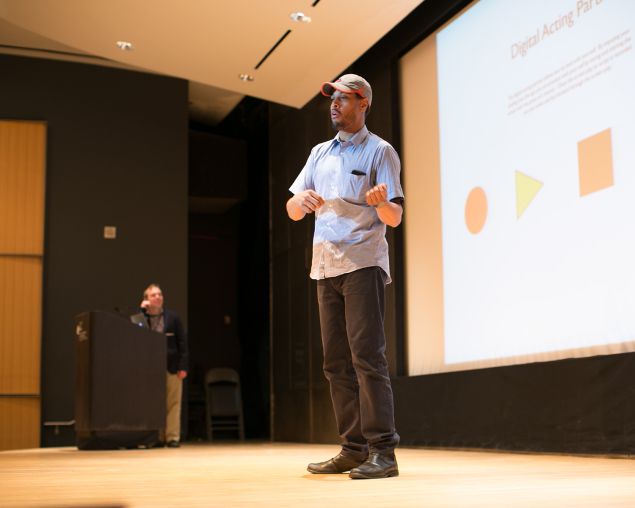 Computer programmer and aspiring actor Ian Ingram presents during the Broadway Hackathon at the New York Public Library for the Performing Arts. In the background is library director Doug Reside.