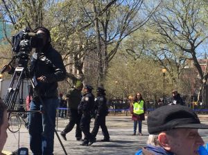 Jerry Foust, who is homeless, is escorted away from a press conference in Tompkins Square Park.