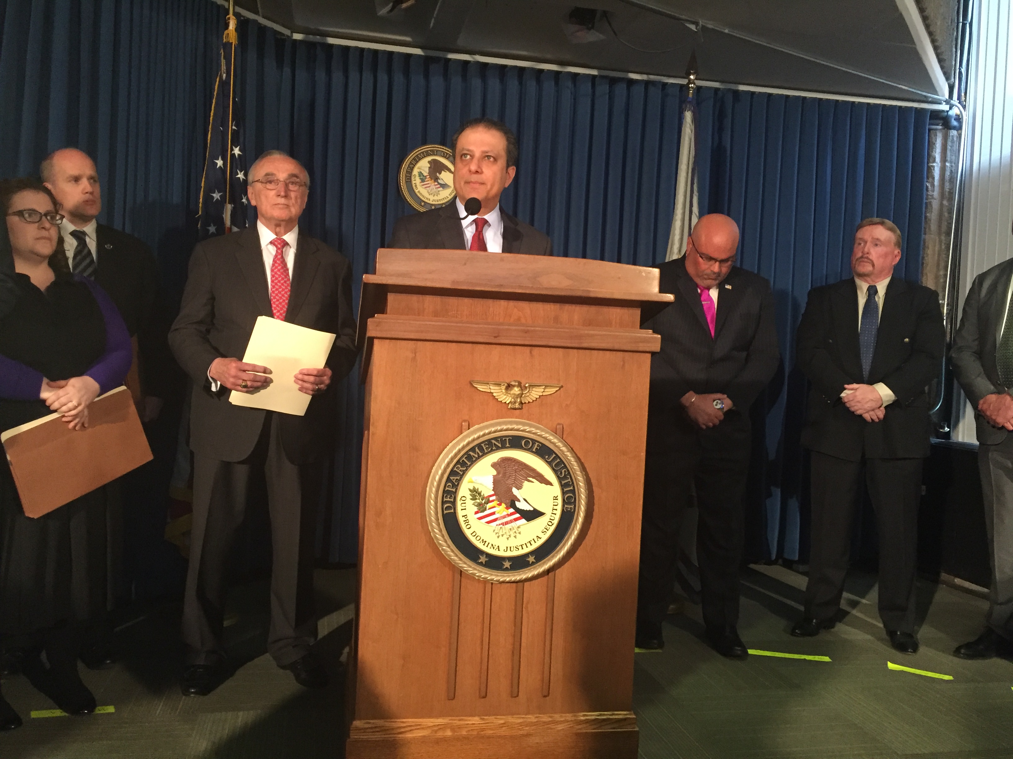 U.S. Attorney Preet Bharara speaks at a press conference today. To his left is Police Commissioner Bill Bratton.