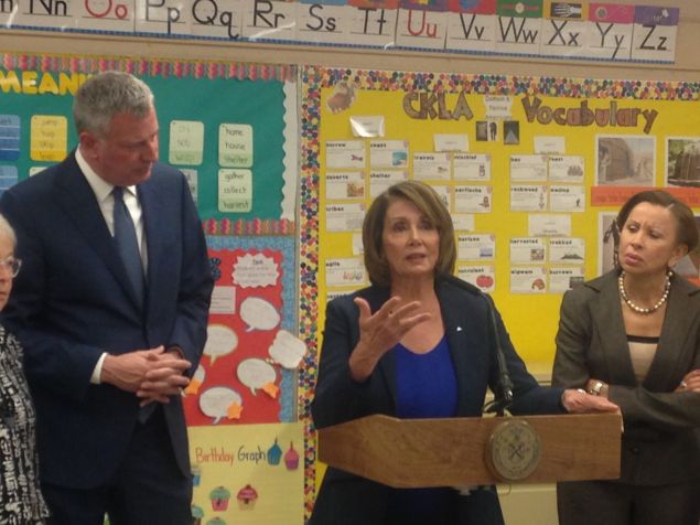 Minority Leader Pelosi, flanked by Mayor Bill de Blasio and Congresswoman Nydia Velazquez.