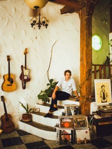 Kevin Morby at home, with his signature red guitar Dorothy at arm's reach
