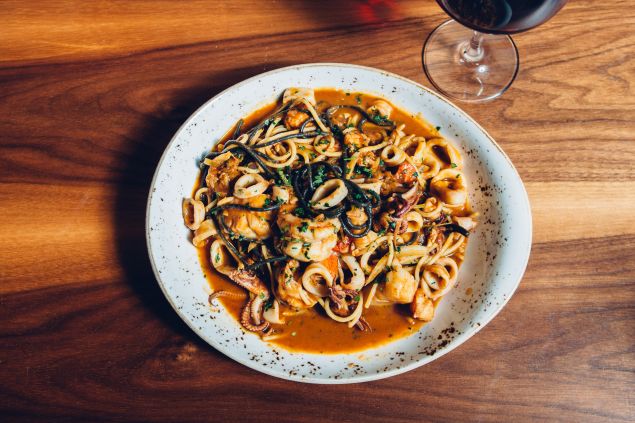Taste the ocean in Herringbone's seafood spaghetti.
