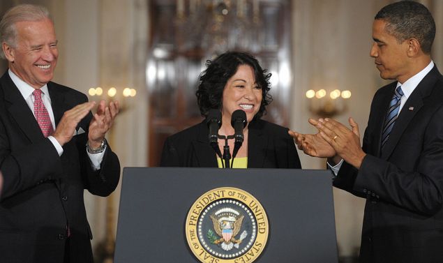US President Barack Obama and US Vice President Joe Biden applaud alongside Obama's nominee for Supreme Court Justice, Appeals Court Judge Sonia Sotomayor, in the East Room of the White House in Washington, DC, May 26, 2009. Sotomayor if confirmed, will serve as the first Hispanic justice on the Supreme Court. AFP PHOTO / Saul LOEB