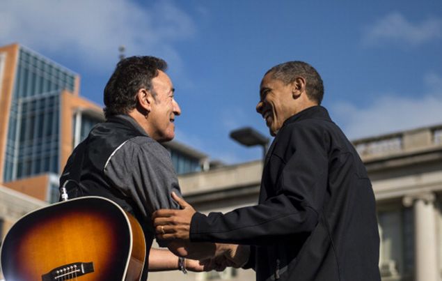 Bruce Springsteen shares a moment with President Barack Obama during a campaign stop in Madison, Wisconsin, on November 5, 2012.