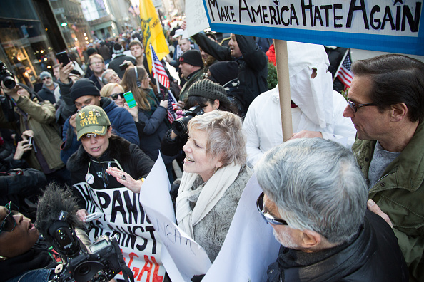 Fighting erupts between pro and anti Trump supporters outside the Trump Towers on 5th Avenue New York.