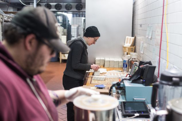 Labels being put on the chocolate bars at Cacao Prieto in red Hook, Brooklyn. 5/24/2016- Photo by Aaron Adler for The Commercial Observer