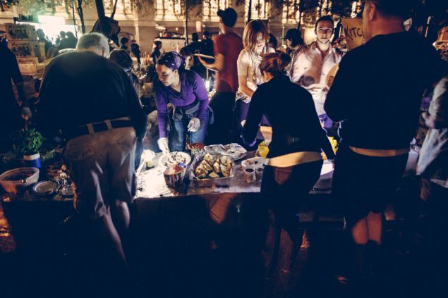 Volunteers serve food to the occupiers in Zuccotti Park.