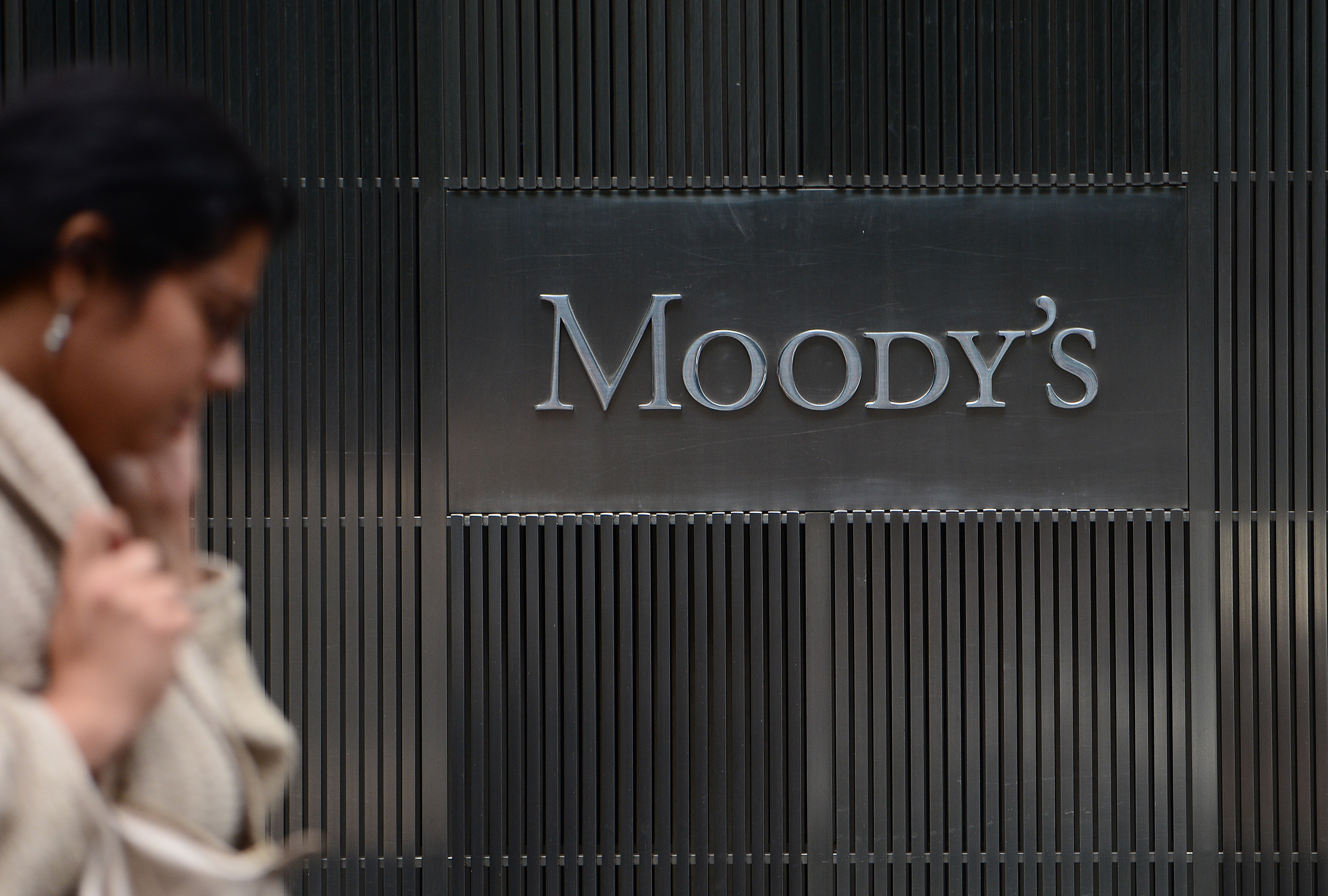 A sign for Moody's rating agency is displayed at the company headquarters in New York, September 18, 2012. AFP PHOTO/Emmanuel Dunand