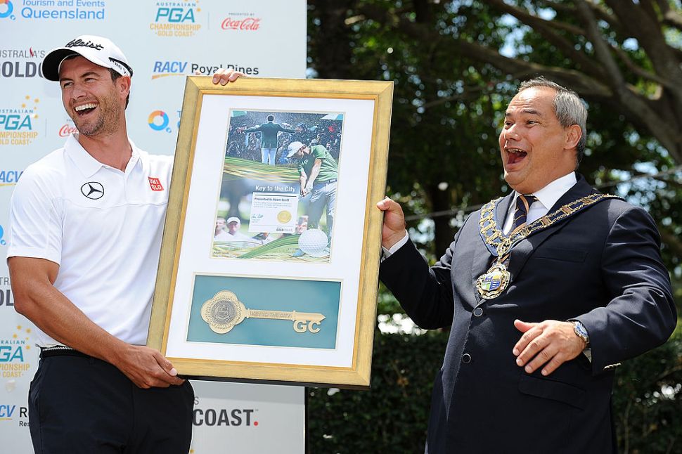 GOLD COAST, AUSTRALIA - NOVEMBER 06: Gold Coast Mayor Tom Tate presents Adam Scott of Australia the Key to the City at Royal Pines Resort on November 6, 2013 on the Gold Coast, Australia.