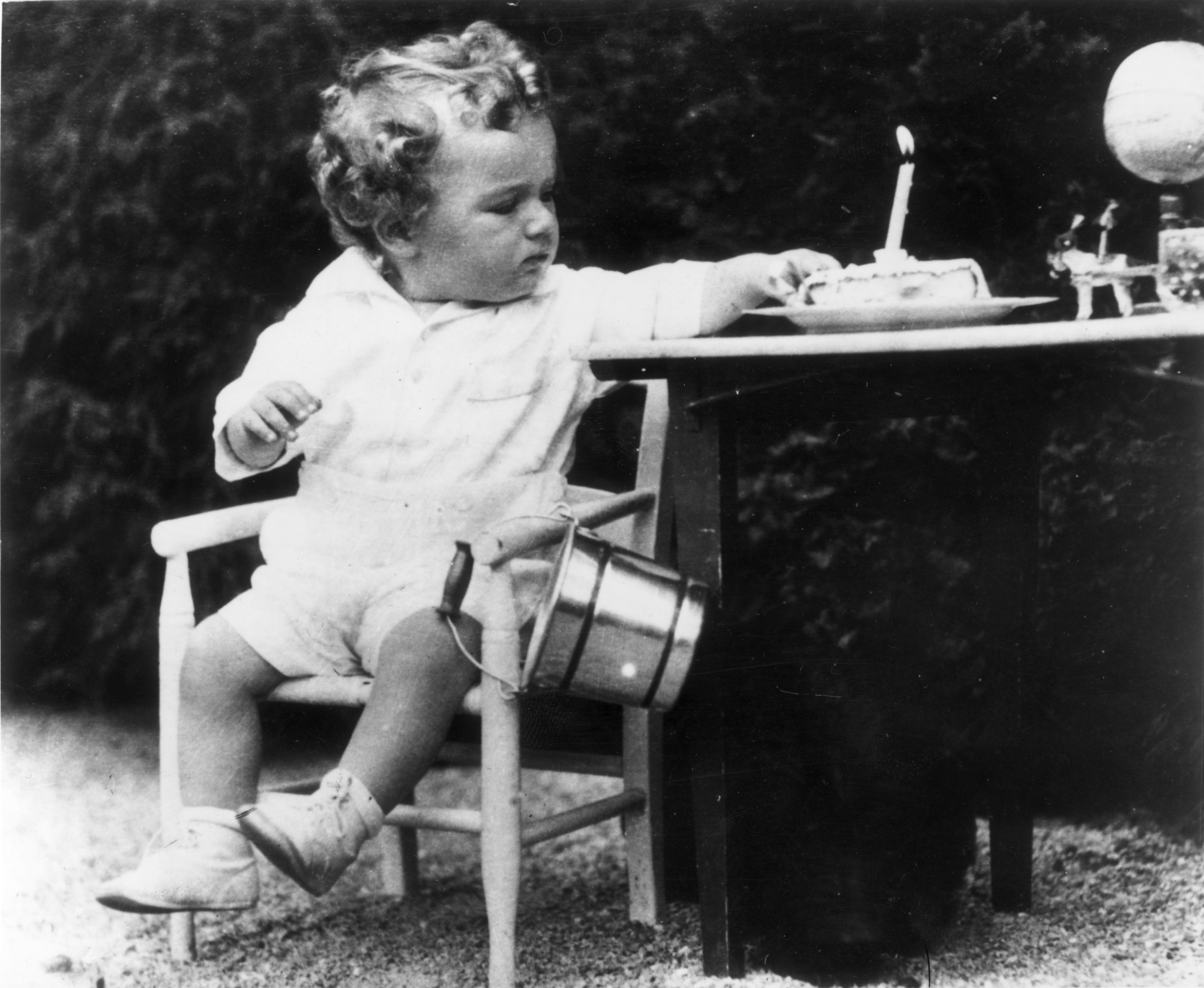 Charles Augustus Lindbergh Jnr, son of the American aviator, on his first birthday. A few months later he was kidnapped from his home and murdered. 
