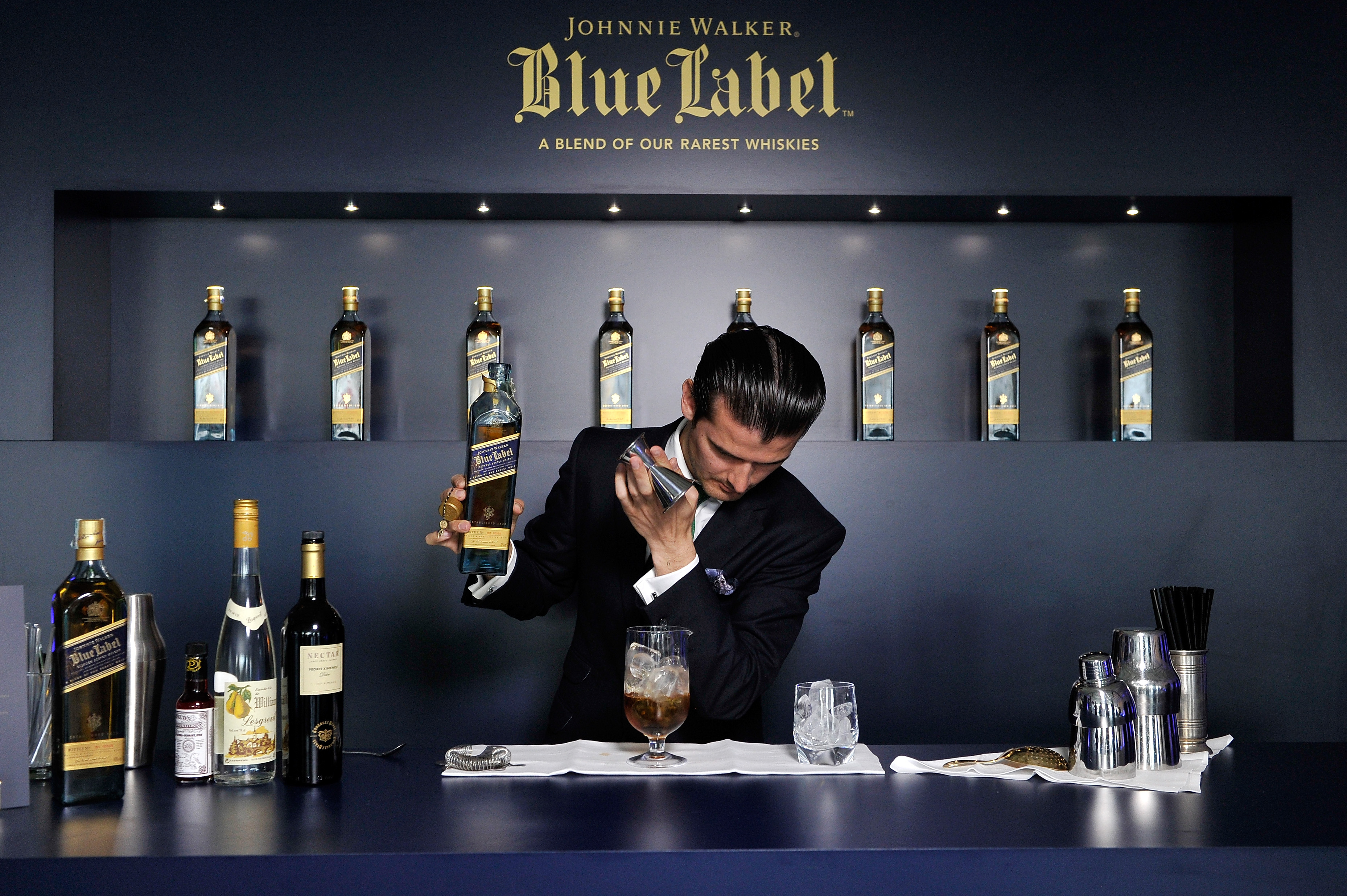 Barman Erik Lorincz is seen making a cocktail as he attends the JOHNNIE WALKER BLUE LABEL drinks reception at the Westin.