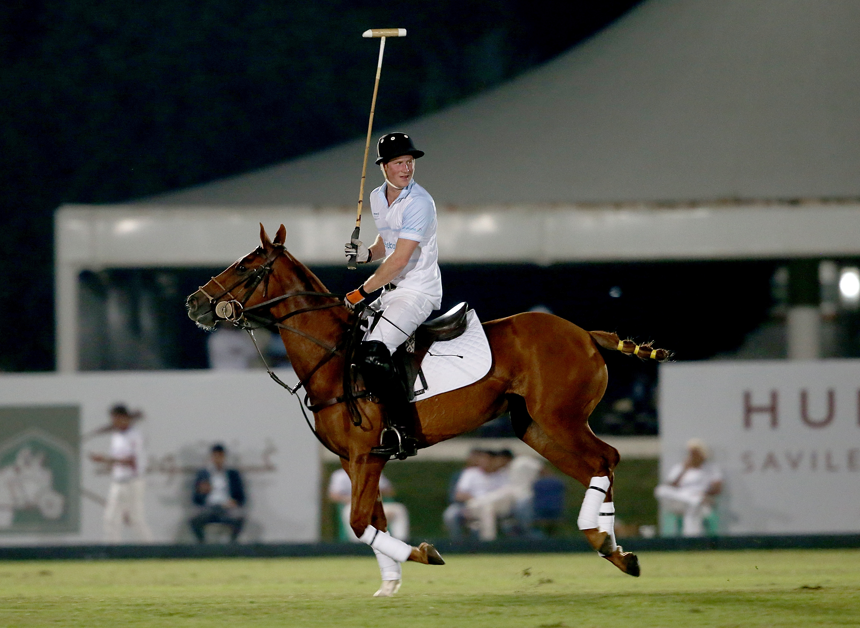 Prince Harry plays during the Sentebale Polo Cup presented by Royal Salute World Polo at Ghantoot Polo Club on November 20, 2014 in Abu Dhabi, United Arab Emirates.