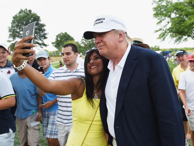 A fan takes a selfie with Donald Trump during the final round of The Barclays at Plainfield Country Club.