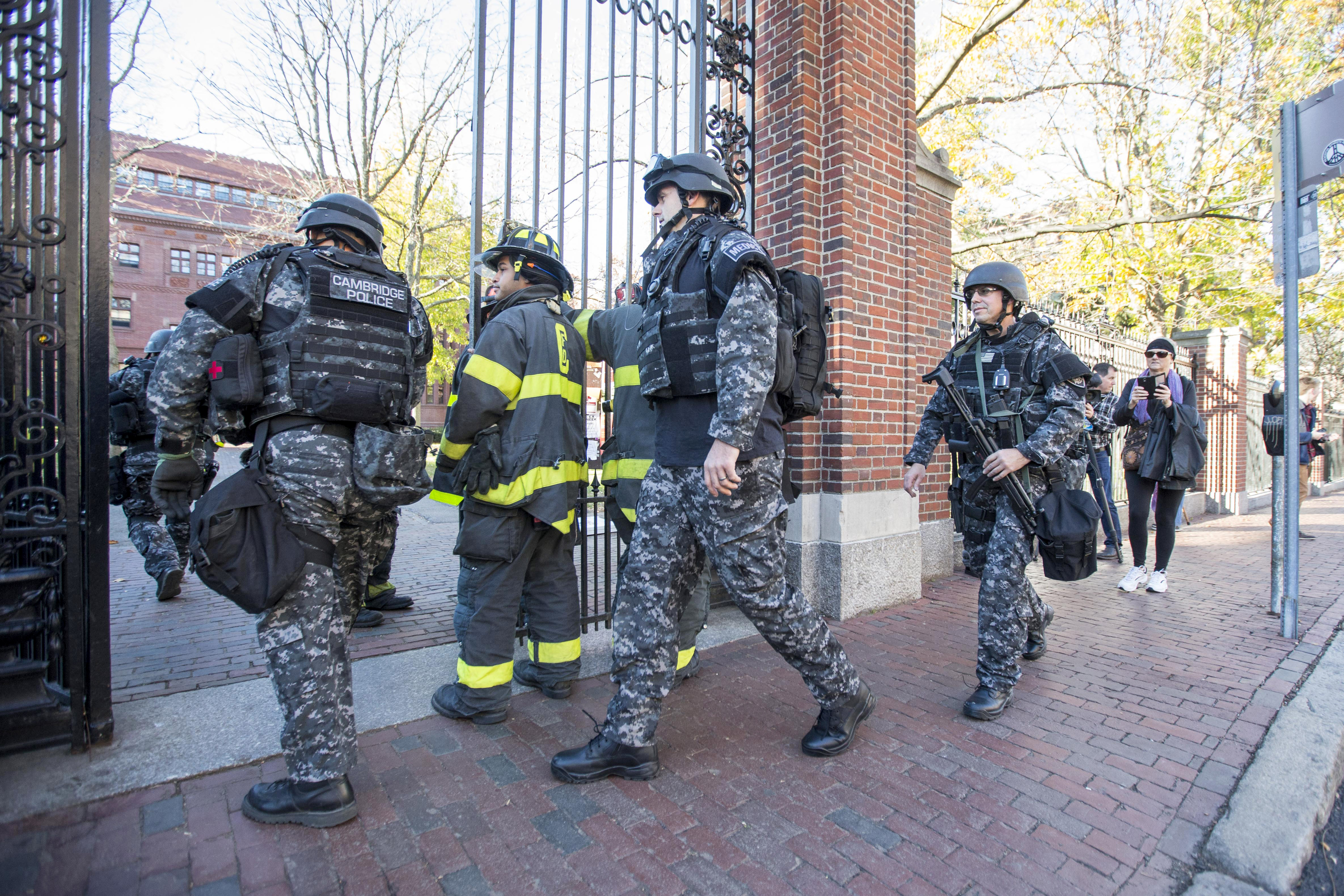 Cambridge Police SWAT team members arrive at Harvard Yard following a bomb threat that was made on campus on November 16, 2015 in Cambridge, Massachusetts. Multiple buildings were evacuated and the Harvard Yard was shut down so that authorities could search.