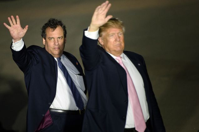 New Jersey Governor Chris Christie (L) and US Republican presidential hopeful Donald Trump (R) depart a rally March 14, 2016 in Vienna Center, Ohio.