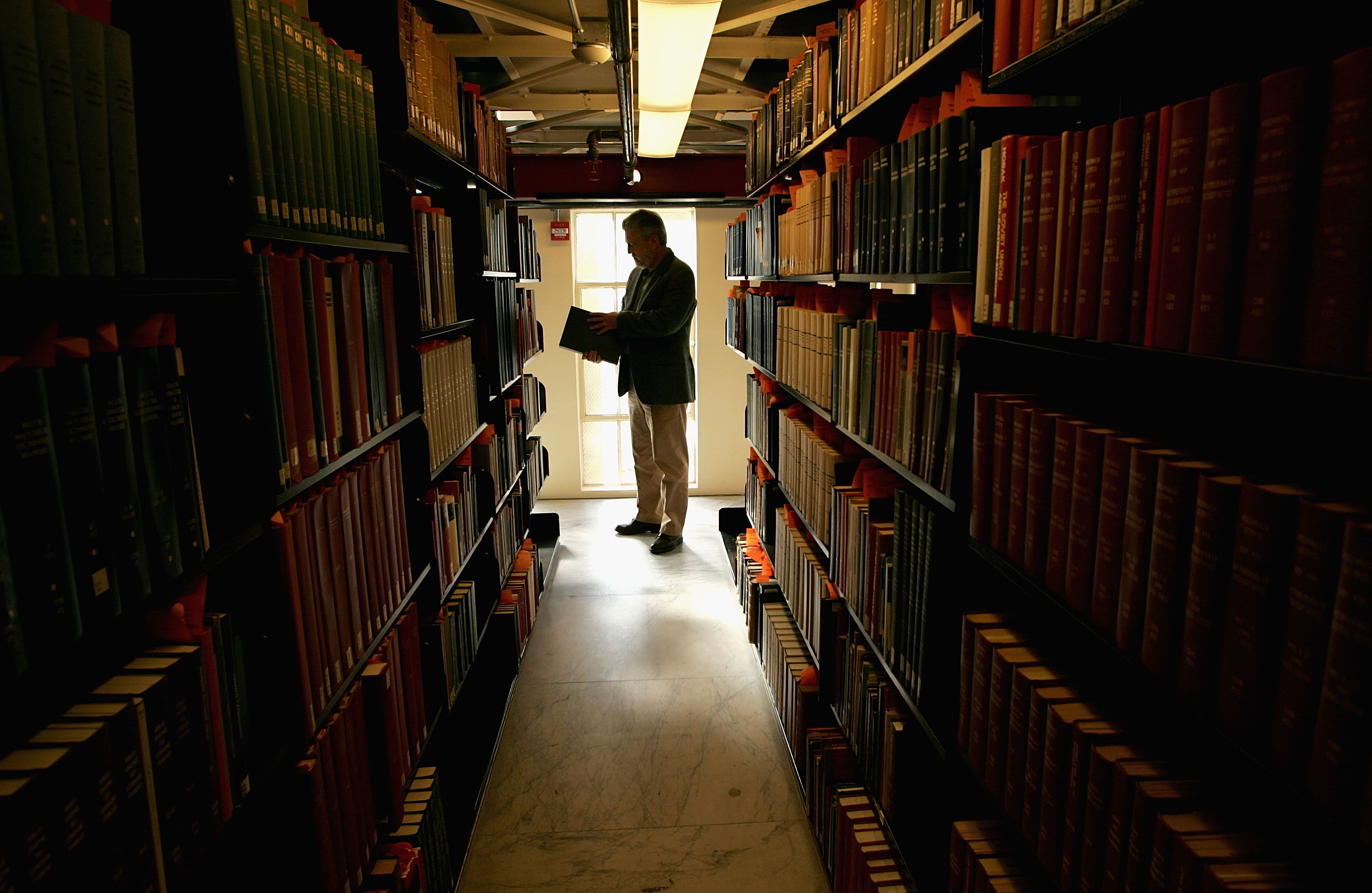 A man browses through books at the Cecil H. Green Library on the Stanford University Campus December 17, 2004 in Stanford, California. Google, the internet search engine, has announced a long-term project to put 15 million books from seven of the world's most prestigious libraries online and make them searchable. Included will be the libraries of Harvard, Stanford, the University of Michigan, the New York Public Library and the University of Oxford, including the Bodleian. Books and periodicals will be scanned and project is expected to take six years and cost more than $100 million.