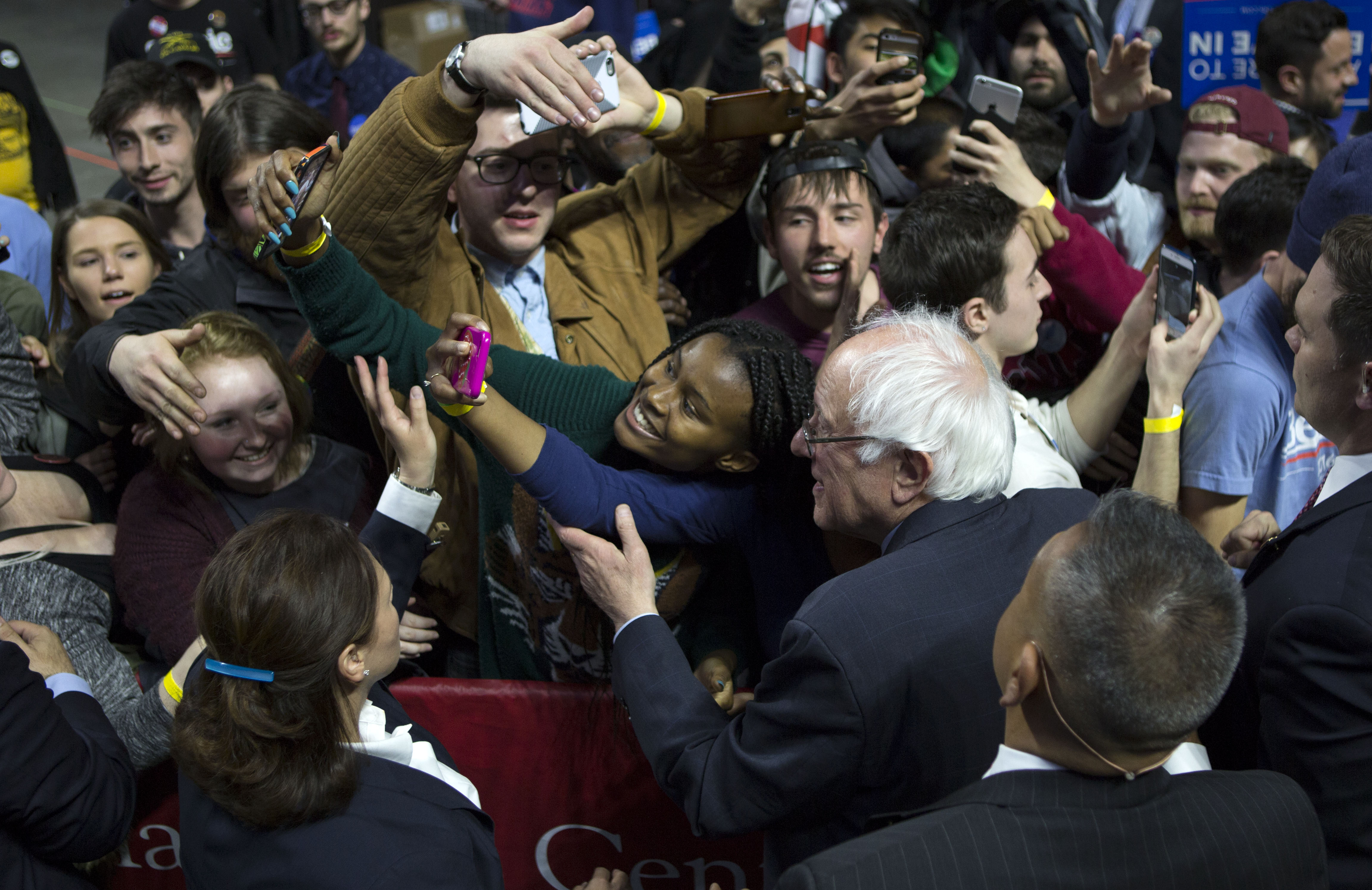 Sen. Bernie Sanders poses for a selfie with supporters at Temple University