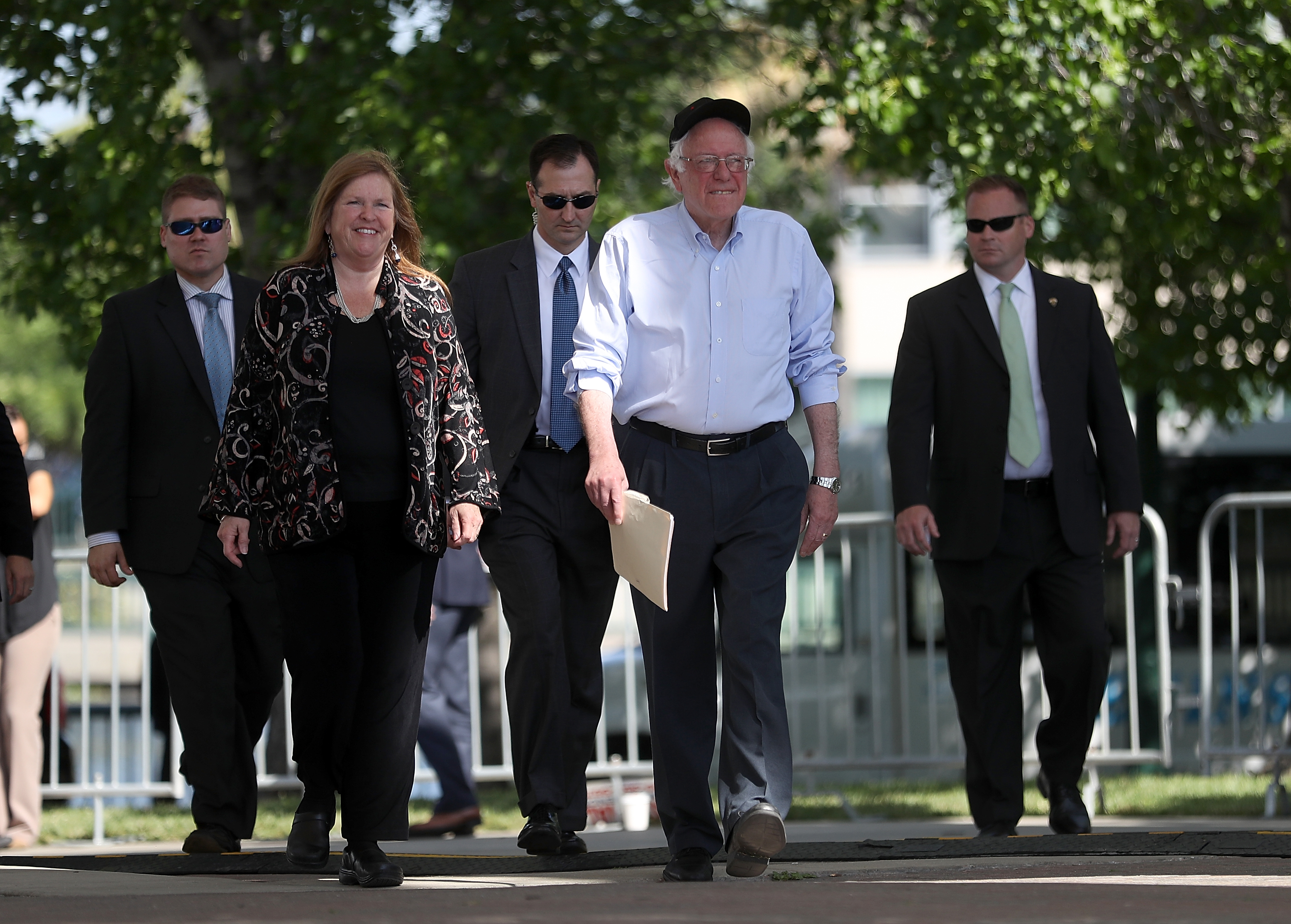 Democratic presidential candidate Sen.Bernie Sanders (D-VT) (2nd R) and his wife Jane O'Meara Sanders arrive at a campaign rally on May 10, 2016 in Stockton, California. Sanders is campaigning in California ahead of the state's June 7th presidential primary.