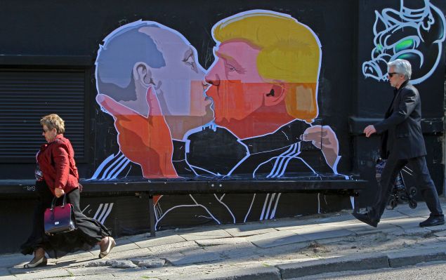 A mural on a restaurant wall in Vilnius depicts U.S. Presidential candidate Donald Trump and Russian President Vladimir Putin kissing.