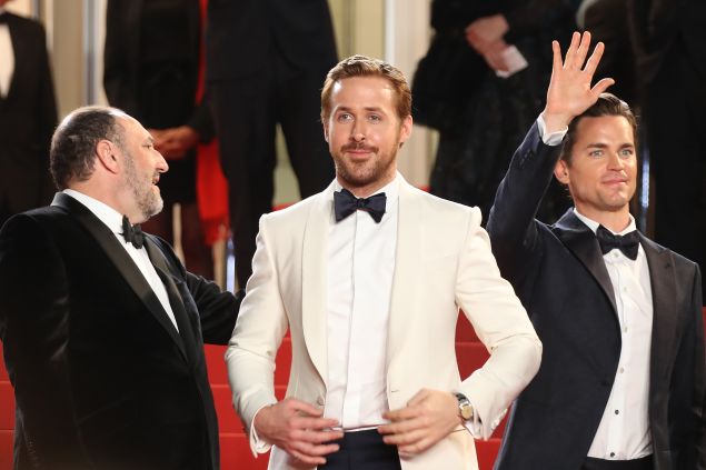 Ryan Gosling steals the scene in a white suit jacket