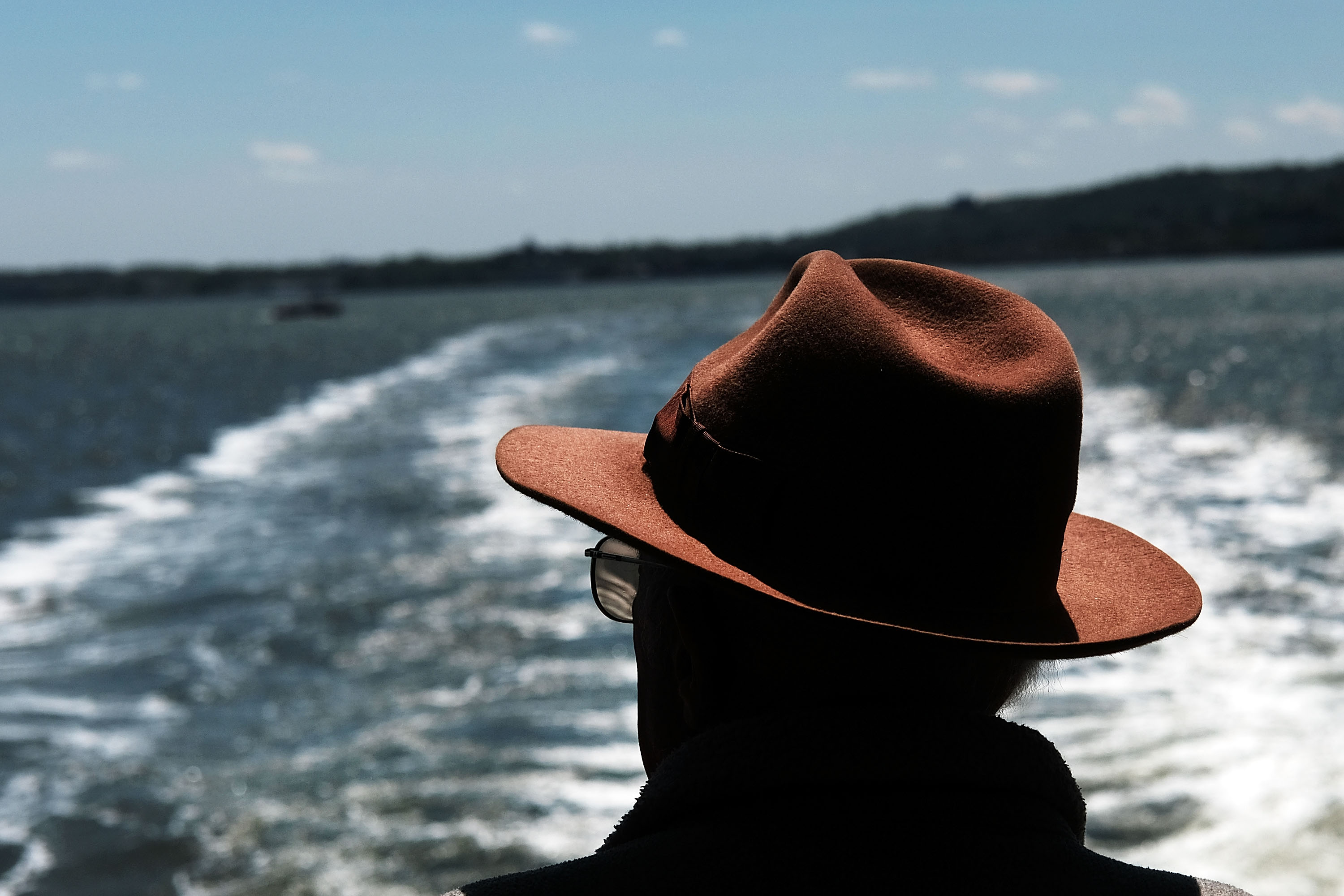NEW YORK, NY - MAY 16: A man looks out at New York Harbor while on the Staten Island Ferry on a blustery spring day in Manhattan on May 16, 2016 in New York, New York. New York has been experiencing cool and windy weather over the past few days with gradual warming expected throughout the week.