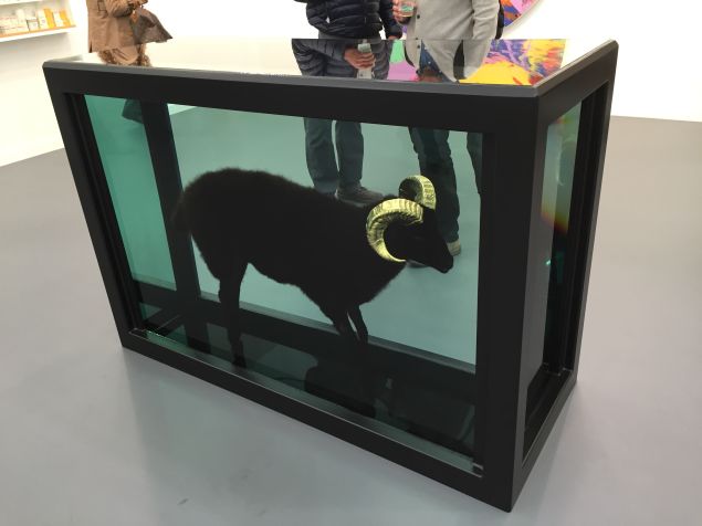 Black Sheep with Golden Horns by Damien Hirst at Gagosian Gallery's booth.