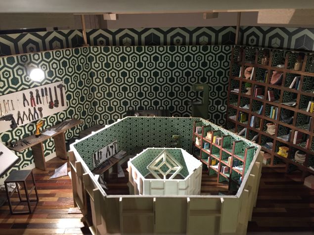 Peering inside a miniature model by Laetitia Soulier.