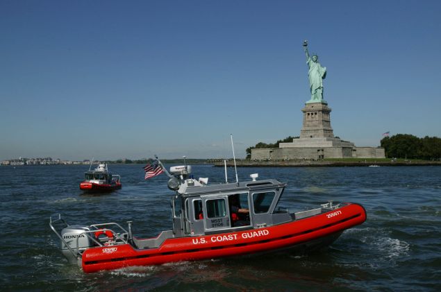 Coast Guard patrol boats motor past the the Statue of Liberty September 9, 2003 in New York City. 
