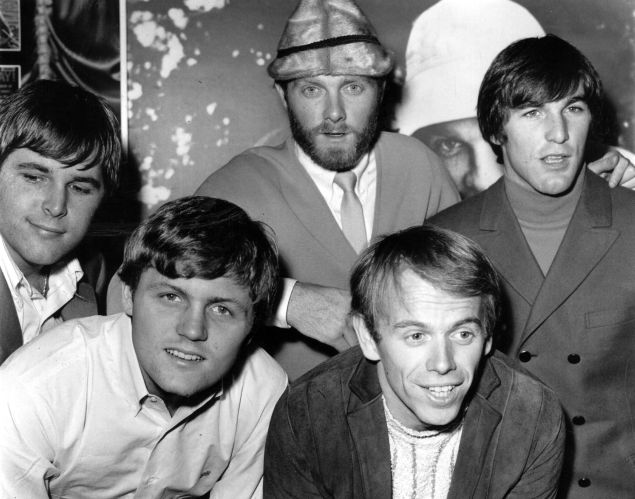 America's top pop group the Beach Boys, from left to right; Carl Wilson (1946 - 1998), Bruce Johnston, Mike Love, Al Jardine and Dennis Wilson (1944 - 1983), at a reception held for them at EMI House in London. Their latest single, 'Good Vibrations', which took six months to produce, is topping the charts. The Beach Boys are here on a concert tour, which sold out as soon as dates were announced.