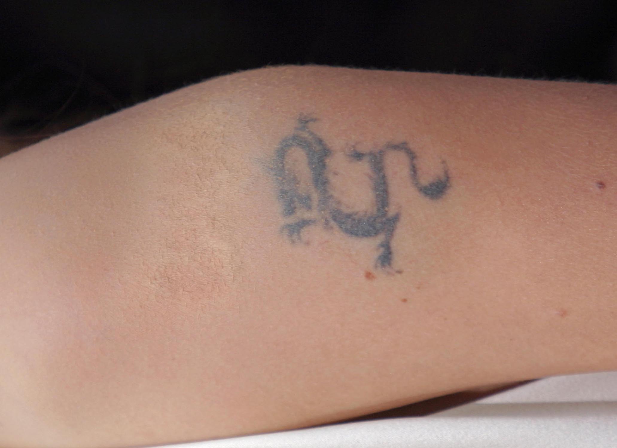 HOLLYWOOD, CA - FEBRUARY 29: Actress Angelina Jolie's faded tattoo at the 76th Annual Academy Awards at the Kodak Theater on February 29, 2004 in Hollywood, California.