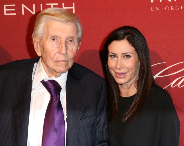 Sumner Redstone (L) and Sydney Holland attend The Hollywood Reporter's Annual Nominees Night Party at Spago on February 10, 2014 in Beverly Hills, California.