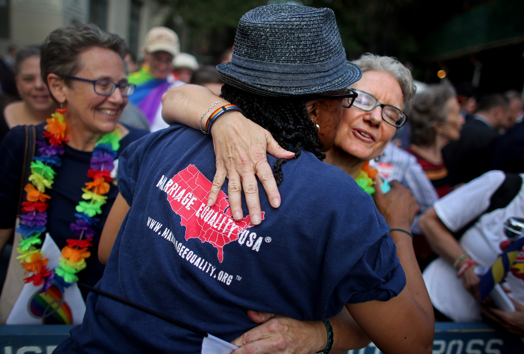 Sheila Marino-Thomas, 52, hugs a friend during a rally in front of the Stonewall Inn after marriage was made legal nationwide.