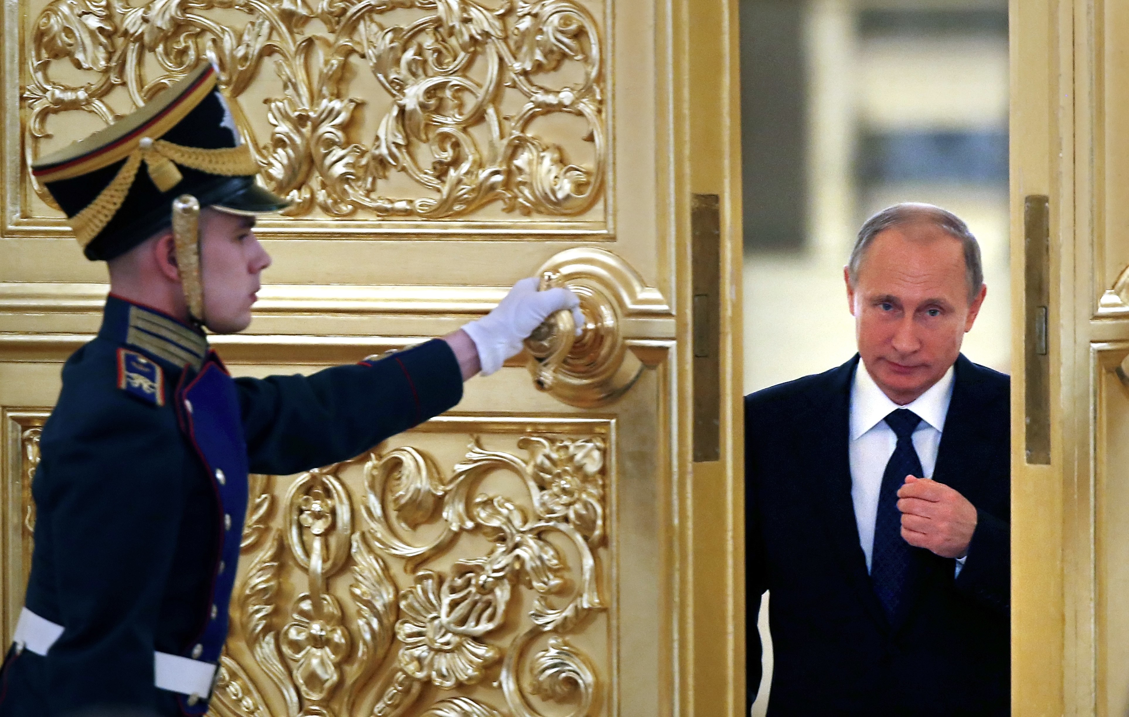 Russian President Vladimir Putin arrives for a meeting of the Presidential Council for Civil Society and Human Rights at the Kremlin in Moscow on October 1, 2015. AFP PHOTO / POOL / YURI KOCHETKOV